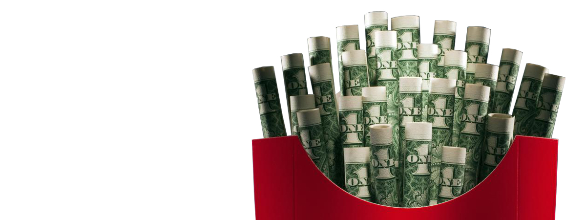 A red food container filled with rolled-up dollar bills resembling french fries, red and green colors on white background